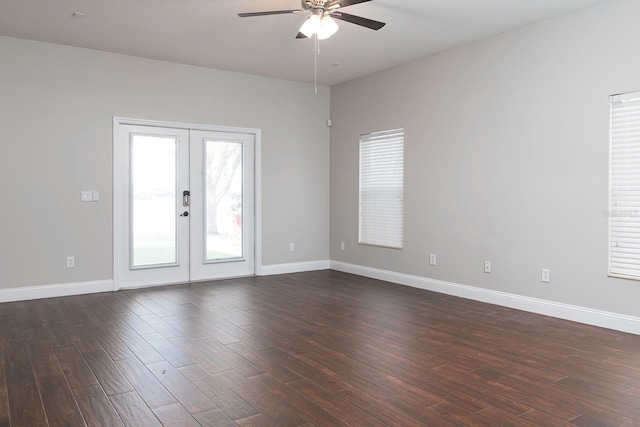 unfurnished room with dark wood-type flooring, french doors, ceiling fan, and baseboards