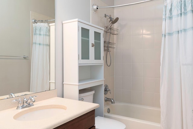 full bath with shower / tub combo, vanity, and toilet