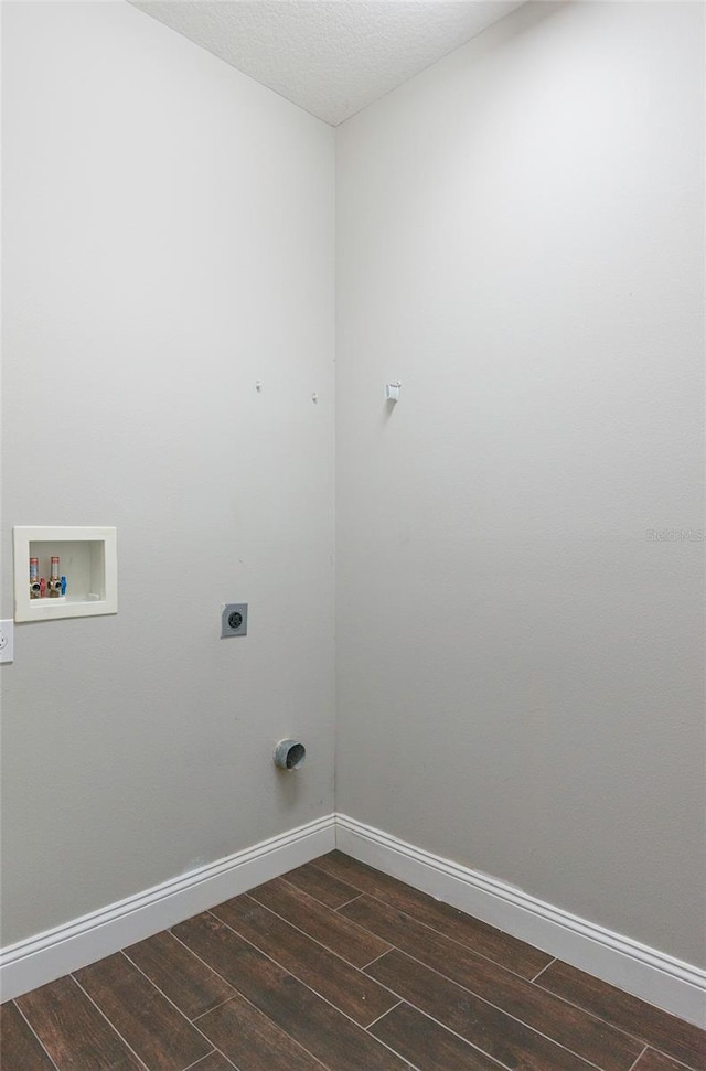 washroom with baseboards, laundry area, dark wood finished floors, and hookup for an electric dryer