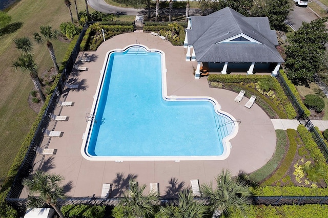 community pool with a patio area