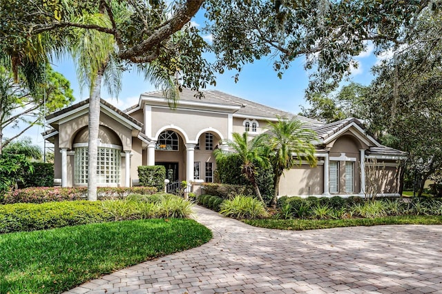 mediterranean / spanish house with stucco siding