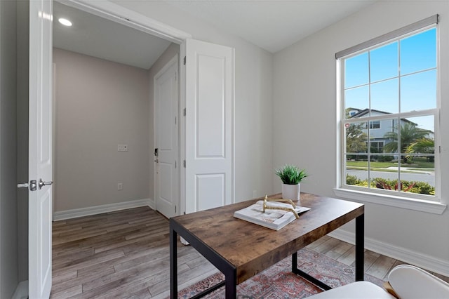 office with recessed lighting, light wood-style flooring, and baseboards