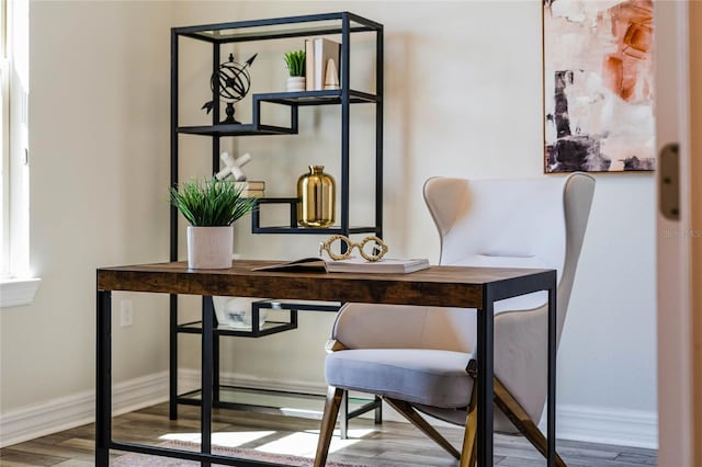 office area featuring baseboards and wood finished floors