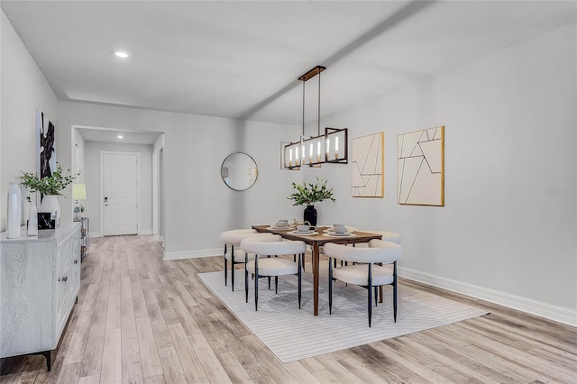 dining area featuring recessed lighting, baseboards, and light wood-type flooring