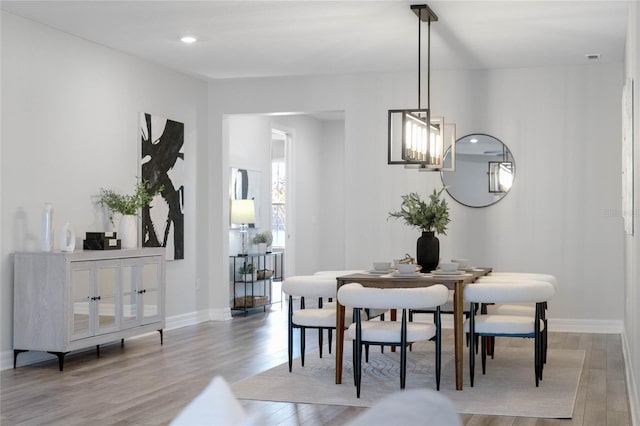 dining area featuring baseboards and wood finished floors