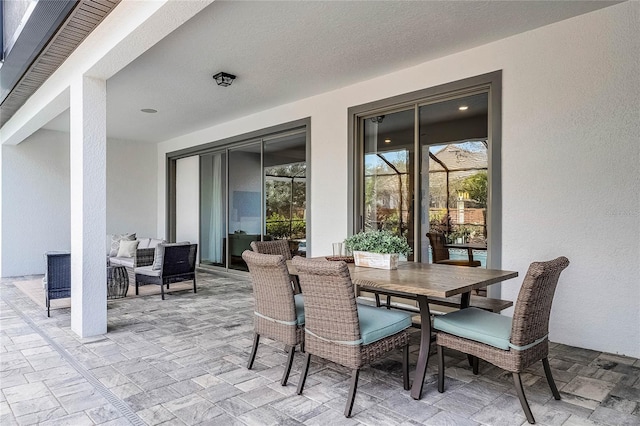 view of patio featuring outdoor dining area