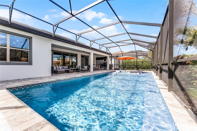 outdoor pool featuring a patio, a lanai, and an outdoor hangout area