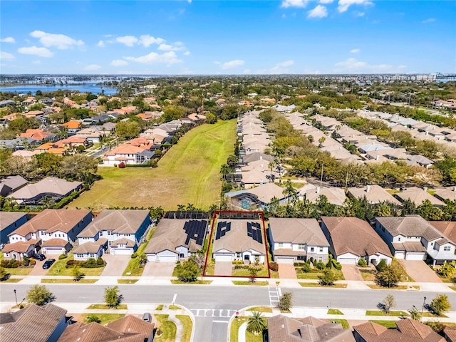 aerial view featuring a residential view and a water view