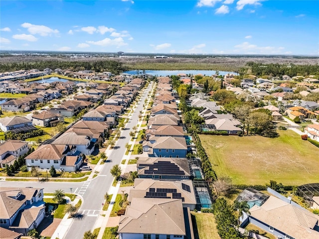 aerial view featuring a water view and a residential view