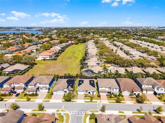 bird's eye view with a residential view and a water view