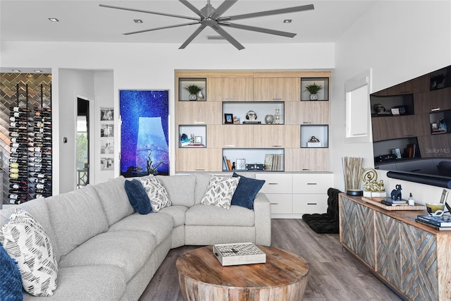 living area featuring ceiling fan and wood finished floors