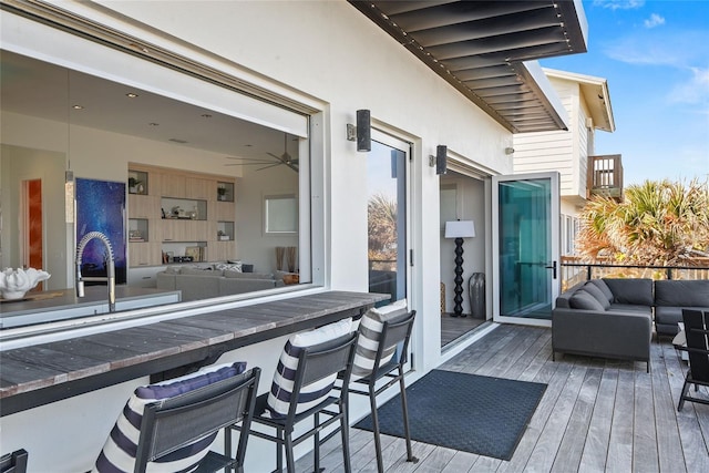 exterior space with outdoor dry bar and an outdoor living space