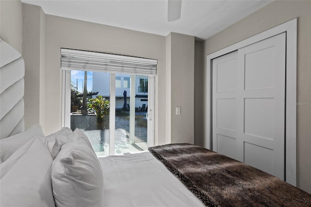 bedroom featuring a closet and a ceiling fan