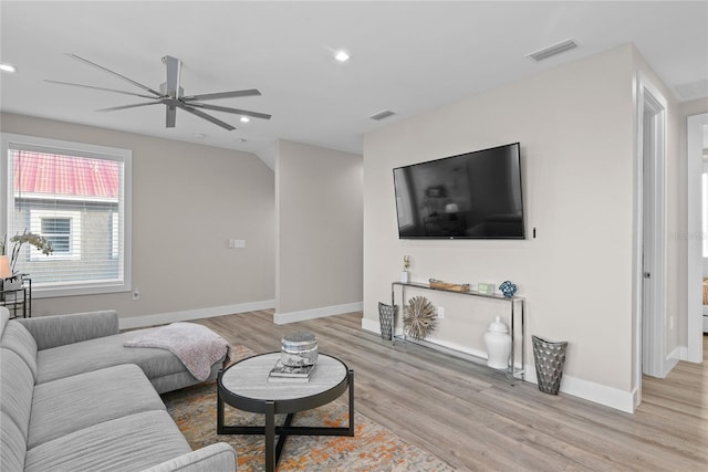 living room featuring recessed lighting, visible vents, light wood-style flooring, and baseboards