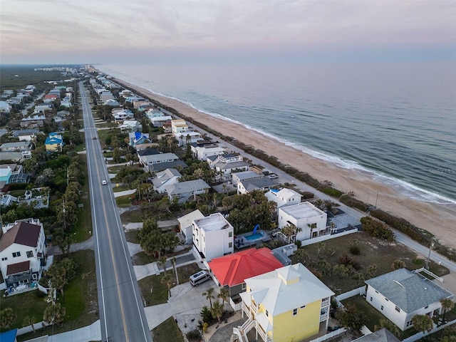 drone / aerial view with a view of the beach and a water view