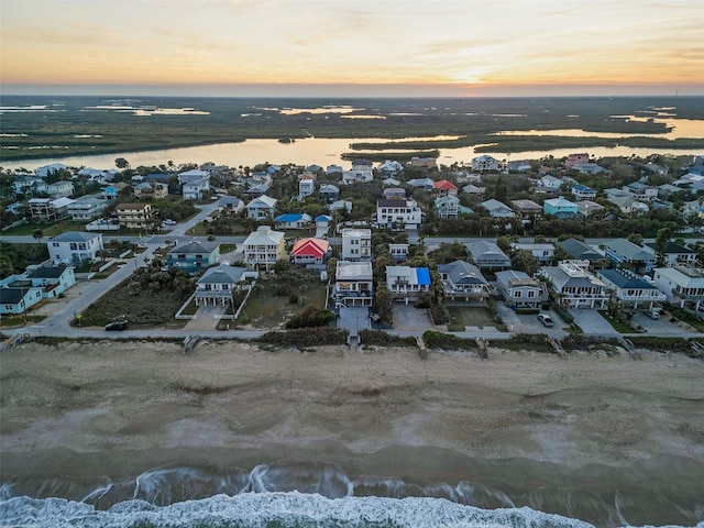 birds eye view of property with a water view and a residential view