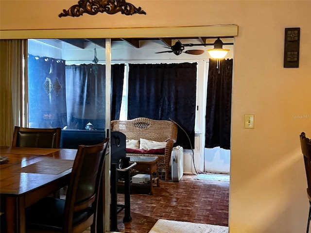 dining space with brick floor