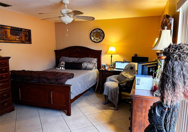 bedroom featuring light tile patterned floors, ceiling fan, and visible vents