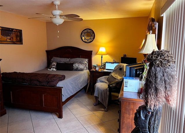 bedroom with ceiling fan and tile patterned floors