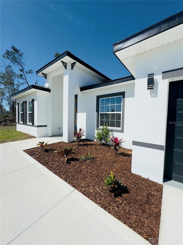 exterior space featuring stucco siding