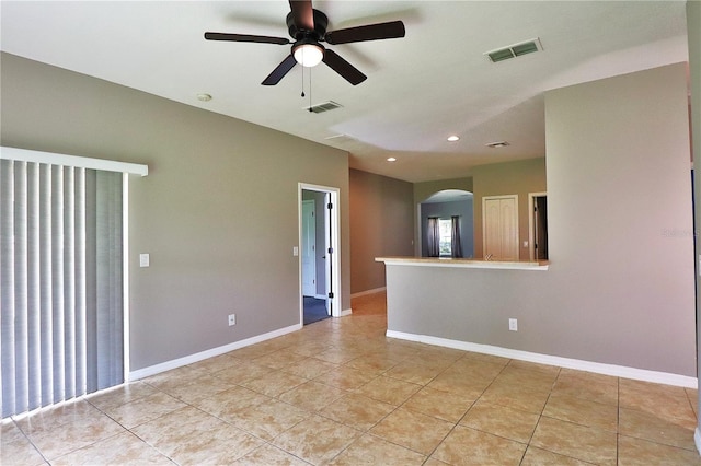 1862 Great Falls Way, Orlando, FL 32824 - empty room featuring arched walkways, ceiling fan, light tile patterned floors, and recessed lighting