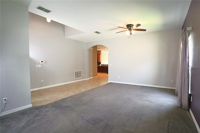 1862 Great Falls Way, Orlando, FL 32824 - carpeted empty room with ceiling fan and arched walkways