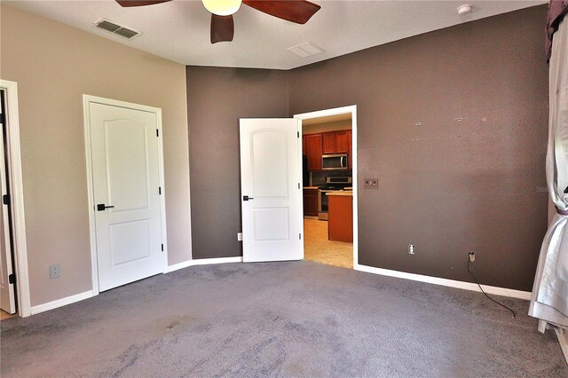 1862 Great Falls Way, Orlando, FL 32824 - unfurnished bedroom featuring carpet flooring and a ceiling fan