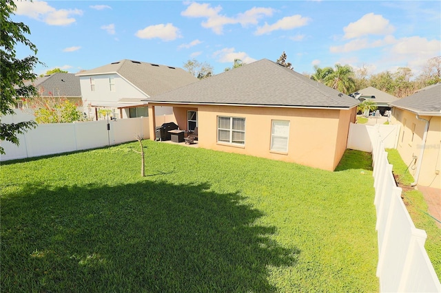 1862 Great Falls Way, Orlando, FL 32824 - rear view of property featuring stucco siding, a fenced backyard, and a shingled roof