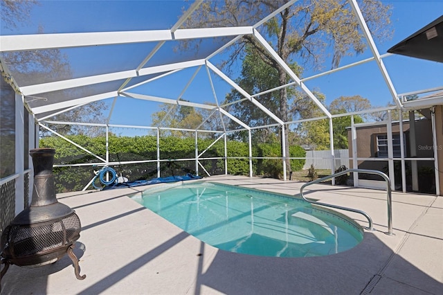 view of pool with a fenced in pool, a lanai, and a patio area