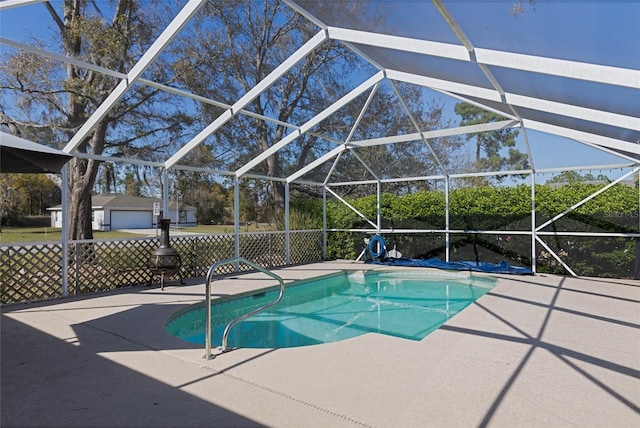 pool with a lanai and a patio