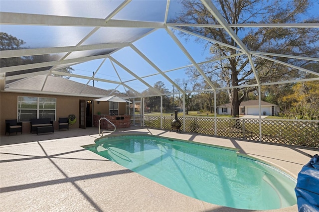 pool with fence, a lanai, outdoor lounge area, and a patio area