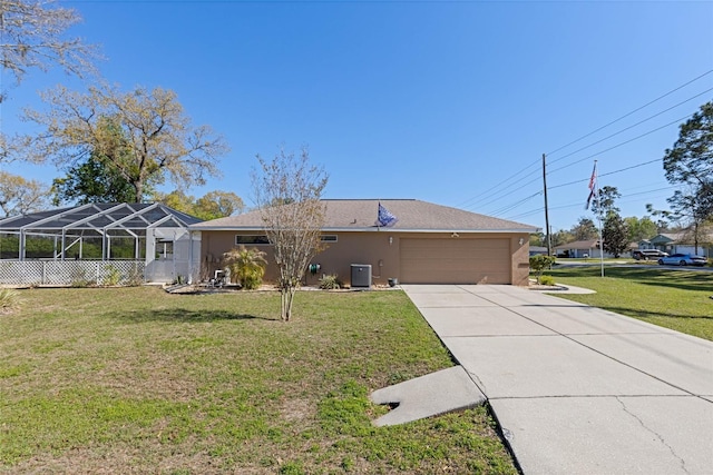 ranch-style home with a lanai, a front yard, stucco siding, a garage, and driveway