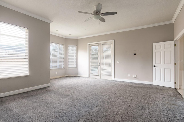 unfurnished bedroom with ornamental molding, carpet flooring, a textured ceiling, and baseboards