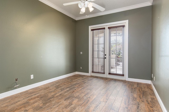 spare room featuring ceiling fan, wood finished floors, baseboards, french doors, and ornamental molding