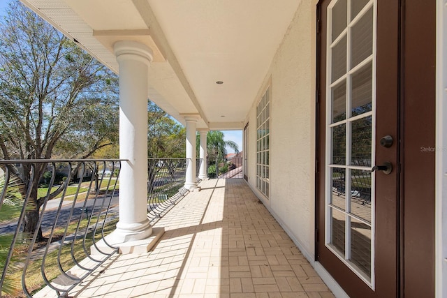 view of patio featuring a balcony