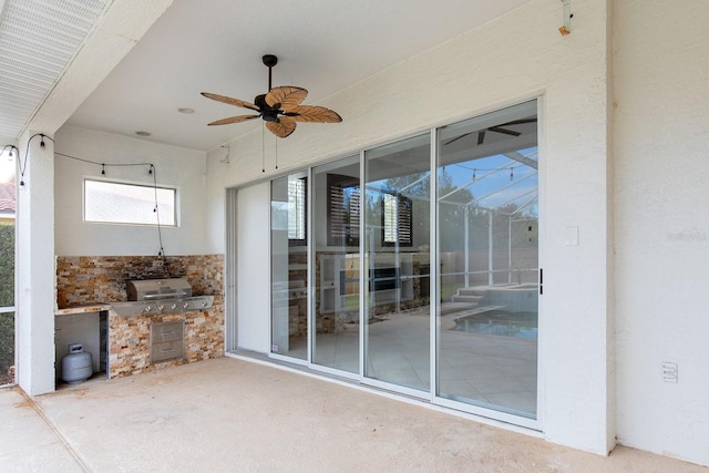 view of patio with a ceiling fan and area for grilling