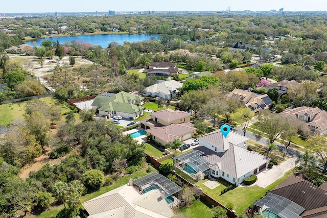 bird's eye view featuring a water view and a residential view