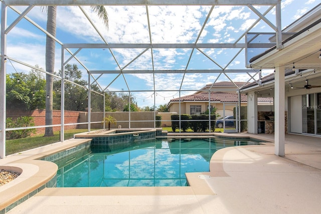 view of pool featuring a fenced in pool, glass enclosure, an in ground hot tub, fence, and a patio area