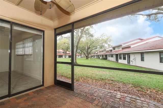 unfurnished sunroom with a residential view