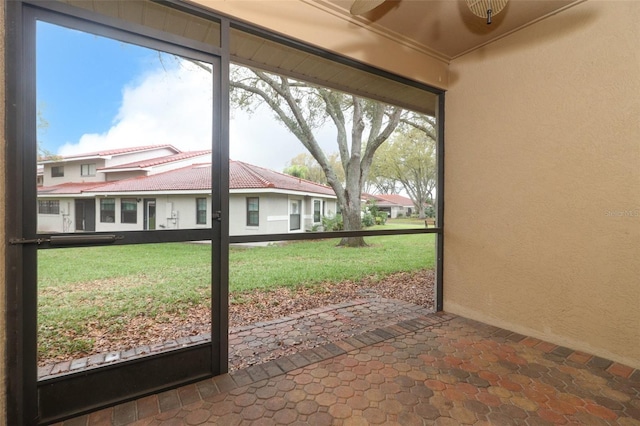 doorway to outside with a textured wall