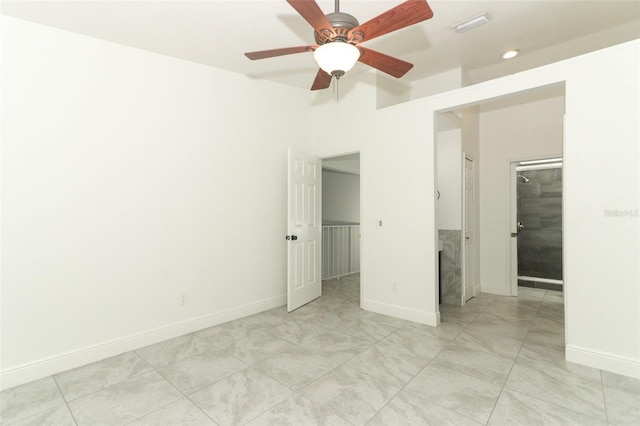 unfurnished bedroom with a ceiling fan, a spacious closet, baseboards, and a closet