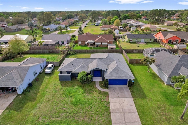 birds eye view of property with a residential view