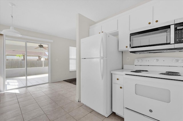 kitchen with white appliances, a healthy amount of sunlight, ceiling fan, and white cabinets