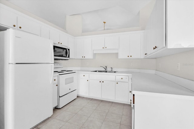 kitchen with light countertops, light tile patterned floors, white cabinets, white appliances, and a sink