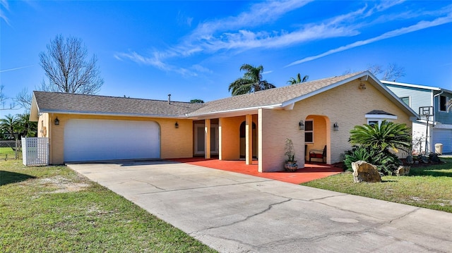 single story home with stucco siding, concrete driveway, fence, a garage, and a front lawn