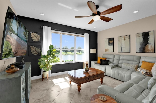 living room with recessed lighting, ceiling fan, baseboards, and light tile patterned floors