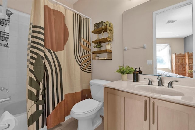 full bath with tile patterned flooring, toilet, vanity, visible vents, and shower / bath combo