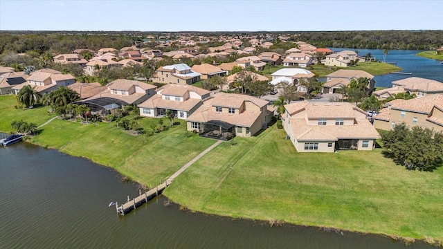 bird's eye view featuring a residential view and a water view