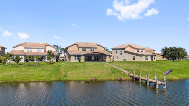 exterior space featuring a water view and a yard