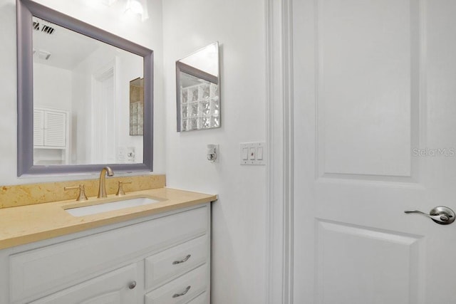 bathroom with visible vents and vanity